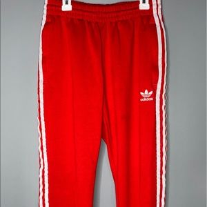 Red track pants